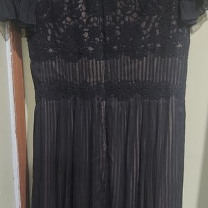 Size 14 very elegant black gown with sheer shoulders.  Black tie ready!!!